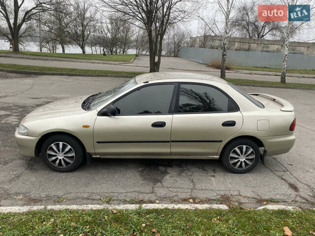 Серый Мазда 323, объемом двигателя 1.5 л и пробегом 286 тыс. км за 2450 $, фото 1 на Automoto.ua