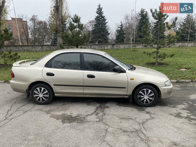 Серый Мазда 323, объемом двигателя 1.5 л и пробегом 286 тыс. км за 2450 $, фото 2 на Automoto.ua