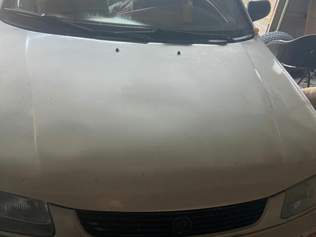 Серый Мазда 323, объемом двигателя 1.49 л и пробегом 310 тыс. км за 1000 $, фото 1 на Automoto.ua