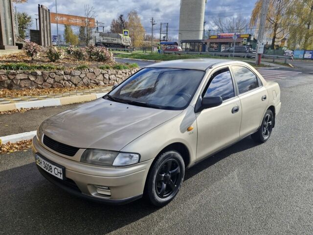 Серый Мазда 323, объемом двигателя 2 л и пробегом 234 тыс. км за 1350 $, фото 6 на Automoto.ua