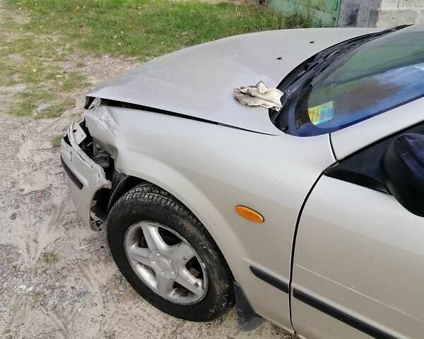 Мазда 323 1999 в Киеве на Automoto.ua Серый Мазда 323, объемом двигателя 1.8 л и пробегом 900 тыс. км за 2600 $, фото 4 на Automoto.ua