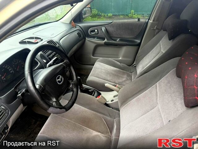 Серый Мазда 323, объемом двигателя 1.6 л и пробегом 35 тыс. км за 2300 $, фото 3 на Automoto.ua