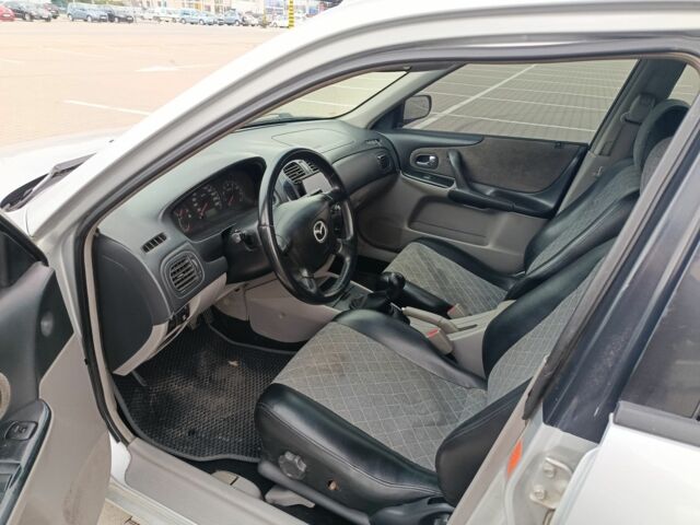 Серый Мазда 323, объемом двигателя 1.6 л и пробегом 370 тыс. км за 2300 $, фото 7 на Automoto.ua