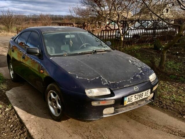 Сірий Мазда 323, об'ємом двигуна 1.5 л та пробігом 300 тис. км за 1200 $, фото 2 на Automoto.ua