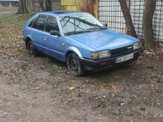 Синий Мазда 323, объемом двигателя 1.5 л и пробегом 250 тыс. км за 521 $, фото 1 на Automoto.ua