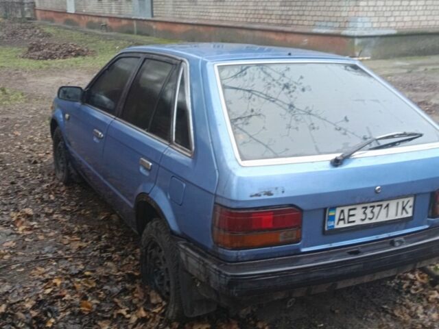 Синий Мазда 323, объемом двигателя 1.5 л и пробегом 250 тыс. км за 521 $, фото 3 на Automoto.ua