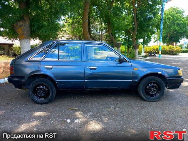 Синій Мазда 323, об'ємом двигуна 1.3 л та пробігом 200 тис. км за 600 $, фото 2 на Automoto.ua