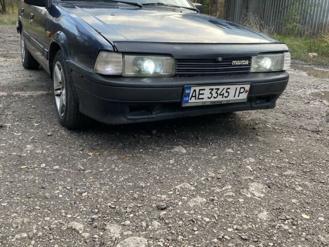 Синий Мазда 323, объемом двигателя 2 л и пробегом 465 тыс. км за 1000 $, фото 2 на Automoto.ua