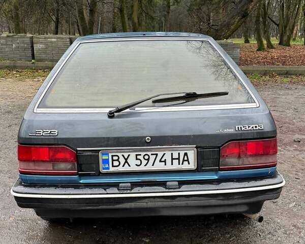 Синий Мазда 323, объемом двигателя 1.32 л и пробегом 220 тыс. км за 950 $, фото 4 на Automoto.ua