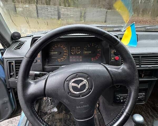 Синий Мазда 323, объемом двигателя 1.32 л и пробегом 220 тыс. км за 950 $, фото 7 на Automoto.ua