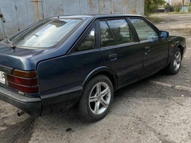 Синий Мазда 323, объемом двигателя 2 л и пробегом 465 тыс. км за 1000 $, фото 1 на Automoto.ua