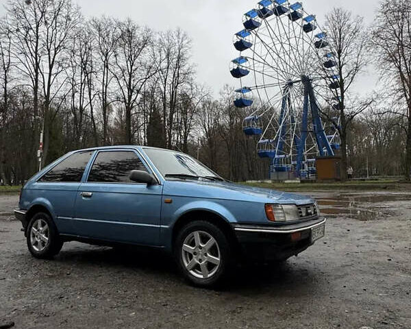 Синий Мазда 323, объемом двигателя 1.32 л и пробегом 246 тыс. км за 850 $, фото 2 на Automoto.ua
