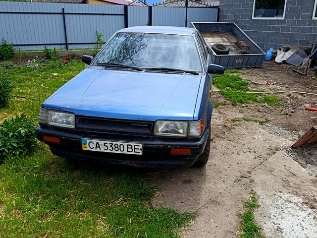 Синій Мазда 323, об'ємом двигуна 1.6 л та пробігом 500 тис. км за 700 $, фото 1 на Automoto.ua