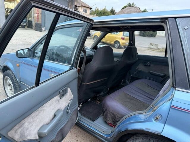 Синій Мазда 323, об'ємом двигуна 1.7 л та пробігом 320 тис. км за 999 $, фото 5 на Automoto.ua