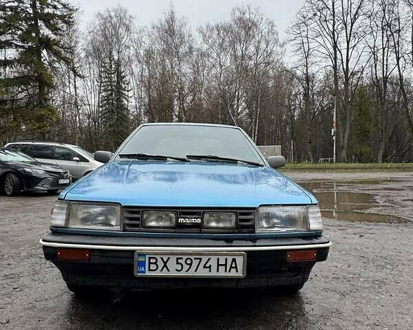 Синий Мазда 323, объемом двигателя 1.32 л и пробегом 220 тыс. км за 950 $, фото 2 на Automoto.ua