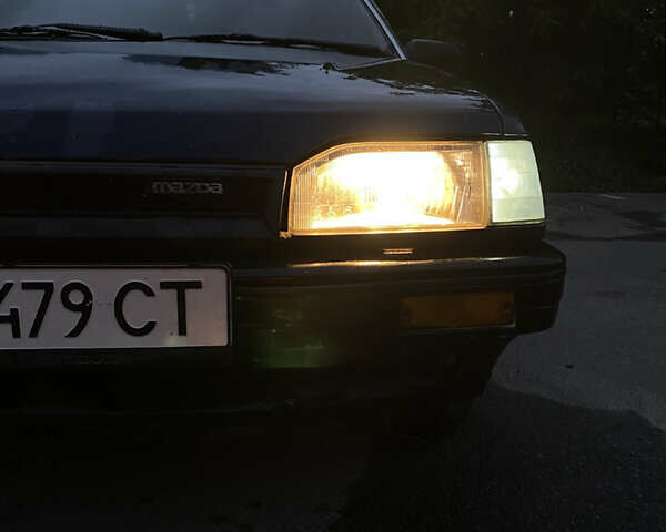 Синий Мазда 323, объемом двигателя 1.5 л и пробегом 505 тыс. км за 650 $, фото 1 на Automoto.ua