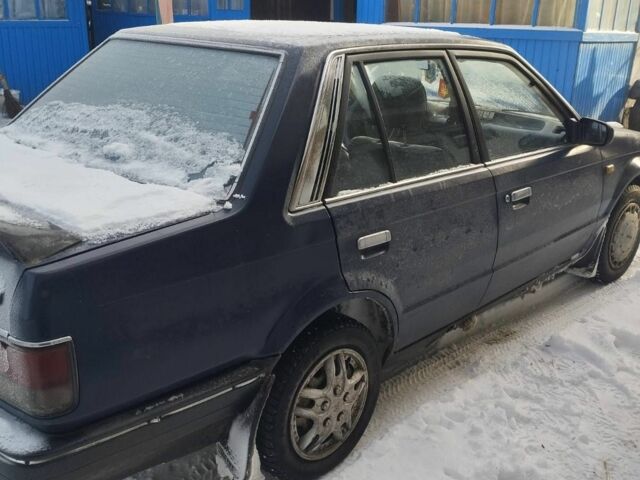 Синий Мазда 323, объемом двигателя 1.5 л и пробегом 300 тыс. км за 900 $, фото 2 на Automoto.ua