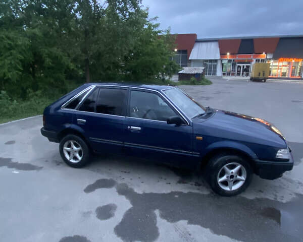 Синий Мазда 323, объемом двигателя 1.5 л и пробегом 505 тыс. км за 650 $, фото 4 на Automoto.ua