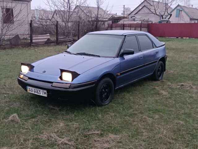 Синий Мазда 323, объемом двигателя 1.6 л и пробегом 260 тыс. км за 832 $, фото 4 на Automoto.ua