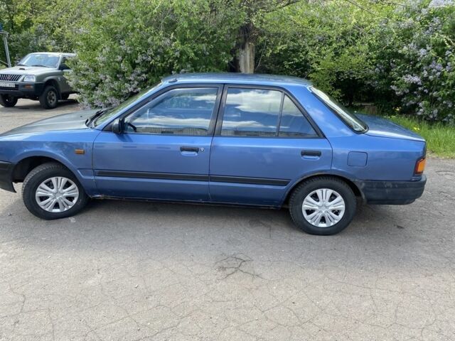 Синий Мазда 323, объемом двигателя 1.3 л и пробегом 600 тыс. км за 950 $, фото 1 на Automoto.ua