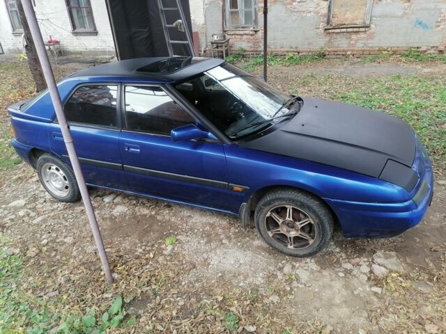 Синий Мазда 323, объемом двигателя 1.6 л и пробегом 10 тыс. км за 1426 $, фото 3 на Automoto.ua