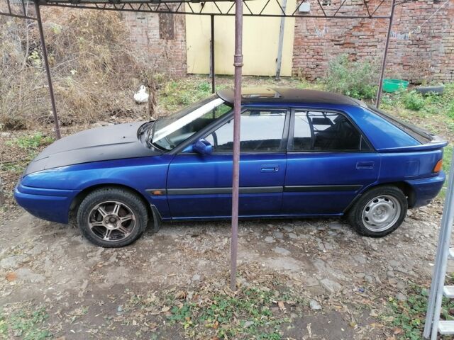 Синий Мазда 323, объемом двигателя 1.6 л и пробегом 10 тыс. км за 1426 $, фото 2 на Automoto.ua