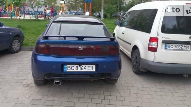 Синій Мазда 323, об'ємом двигуна 2 л та пробігом 300 тис. км за 2200 $, фото 1 на Automoto.ua