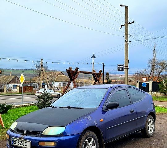 Синій Мазда 323, об'ємом двигуна 1.3 л та пробігом 200 тис. км за 1150 $, фото 4 на Automoto.ua