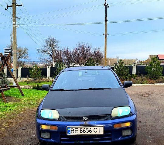 Синій Мазда 323, об'ємом двигуна 1.3 л та пробігом 200 тис. км за 1150 $, фото 1 на Automoto.ua