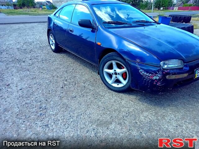 Синій Мазда 323, об'ємом двигуна 1.5 л та пробігом 350 тис. км за 1400 $, фото 1 на Automoto.ua