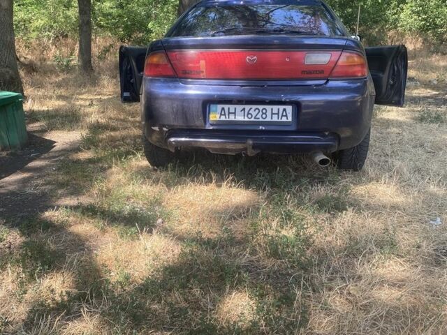 Синий Мазда 323, объемом двигателя 1.5 л и пробегом 350 тыс. км за 1350 $, фото 1 на Automoto.ua