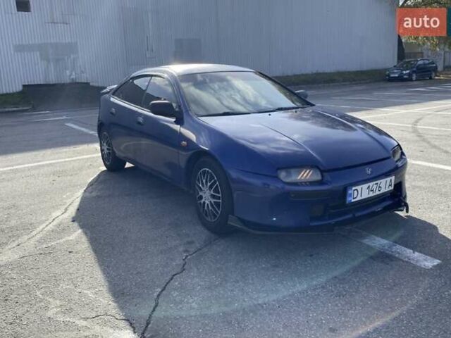 Синий Мазда 323, объемом двигателя 1.49 л и пробегом 286 тыс. км за 3000 $, фото 2 на Automoto.ua