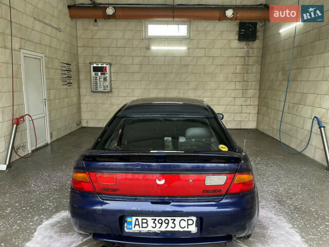 Синий Мазда 323, объемом двигателя 1.49 л и пробегом 329 тыс. км за 1500 $, фото 1 на Automoto.ua