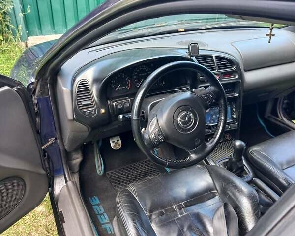 Синий Мазда 323, объемом двигателя 1.5 л и пробегом 350 тыс. км за 3300 $, фото 6 на Automoto.ua