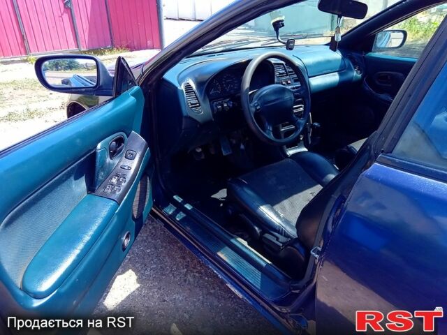 Синій Мазда 323, об'ємом двигуна 1.5 л та пробігом 350 тис. км за 1400 $, фото 4 на Automoto.ua