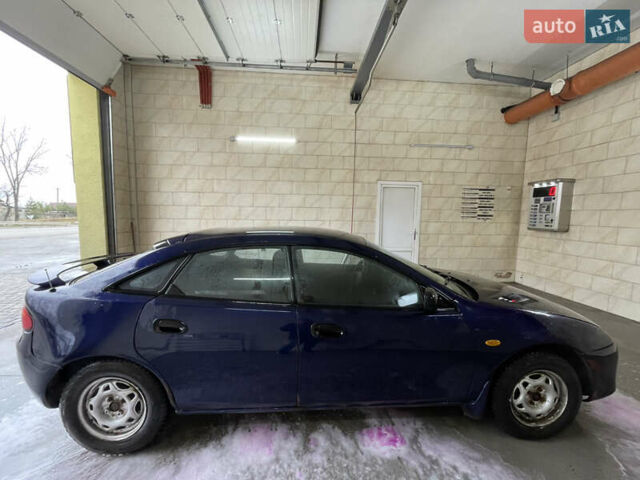 Синий Мазда 323, объемом двигателя 1.49 л и пробегом 329 тыс. км за 1500 $, фото 4 на Automoto.ua