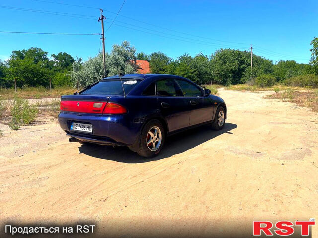 Синий Мазда 323, объемом двигателя 1.5 л и пробегом 400 тыс. км за 2000 $, фото 2 на Automoto.ua