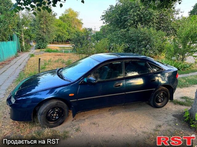 Синій Мазда 323, об'ємом двигуна 1.5 л та пробігом 348 тис. км за 2000 $, фото 2 на Automoto.ua