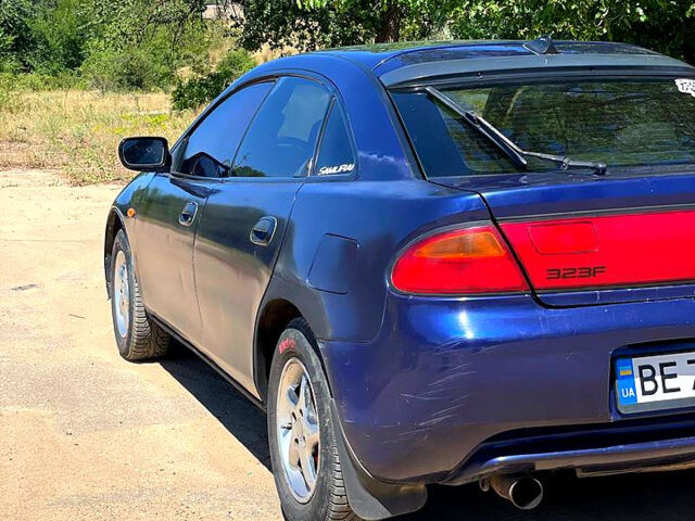 Синий Мазда 323, объемом двигателя 1.5 л и пробегом 400 тыс. км за 2000 $, фото 4 на Automoto.ua