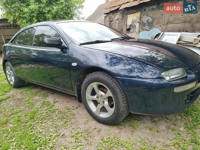Синий Мазда 323, объемом двигателя 1.5 л и пробегом 305 тыс. км за 2300 $, фото 2 на Automoto.ua
