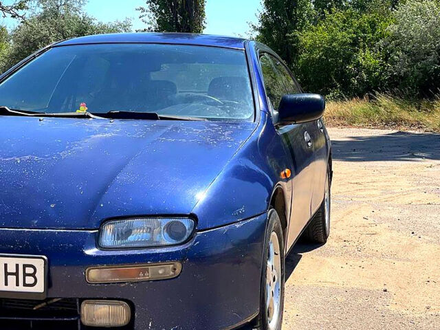 Синий Мазда 323, объемом двигателя 1.5 л и пробегом 400 тыс. км за 2000 $, фото 5 на Automoto.ua