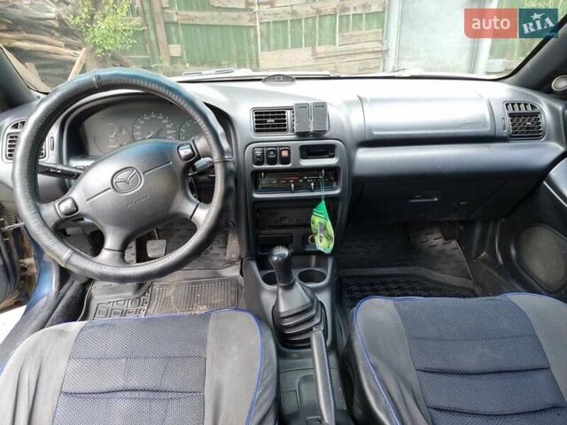 Синий Мазда 323, объемом двигателя 1.5 л и пробегом 305 тыс. км за 2300 $, фото 7 на Automoto.ua