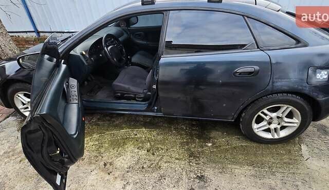 Синий Мазда 323, объемом двигателя 1.5 л и пробегом 237 тыс. км за 2200 $, фото 2 на Automoto.ua