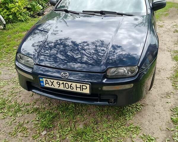 Синий Мазда 323, объемом двигателя 1.5 л и пробегом 305 тыс. км за 2300 $, фото 1 на Automoto.ua