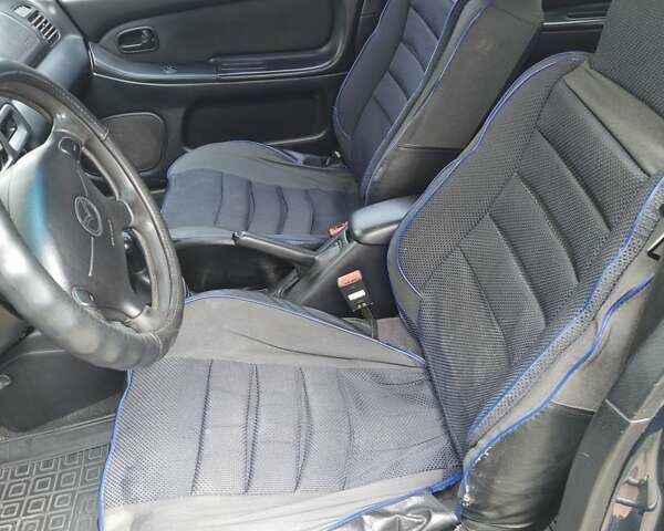 Синий Мазда 323, объемом двигателя 1.5 л и пробегом 305 тыс. км за 2300 $, фото 9 на Automoto.ua