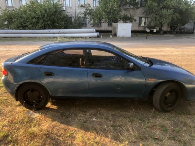 Синий Мазда 323, объемом двигателя 1.5 л и пробегом 388 тыс. км за 1800 $, фото 5 на Automoto.ua