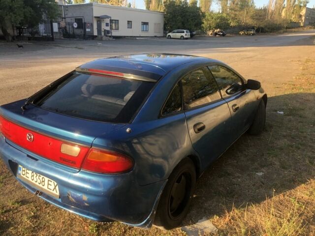 Синий Мазда 323, объемом двигателя 1.5 л и пробегом 388 тыс. км за 1800 $, фото 2 на Automoto.ua