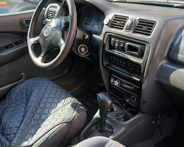 Синий Мазда 323, объемом двигателя 1.5 л и пробегом 332 тыс. км за 3000 $, фото 8 на Automoto.ua