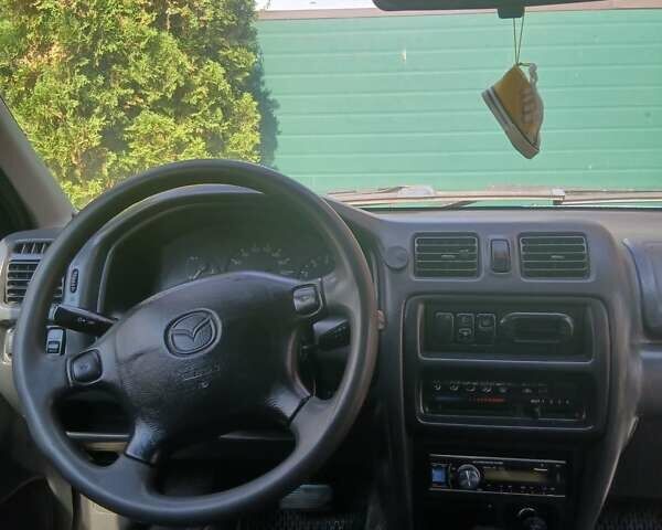 Синий Мазда 323, объемом двигателя 1.5 л и пробегом 332 тыс. км за 3000 $, фото 1 на Automoto.ua