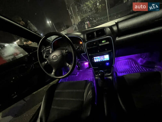 Синій Мазда 323, об'ємом двигуна 1.49 л та пробігом 343 тис. км за 2100 $, фото 9 на Automoto.ua